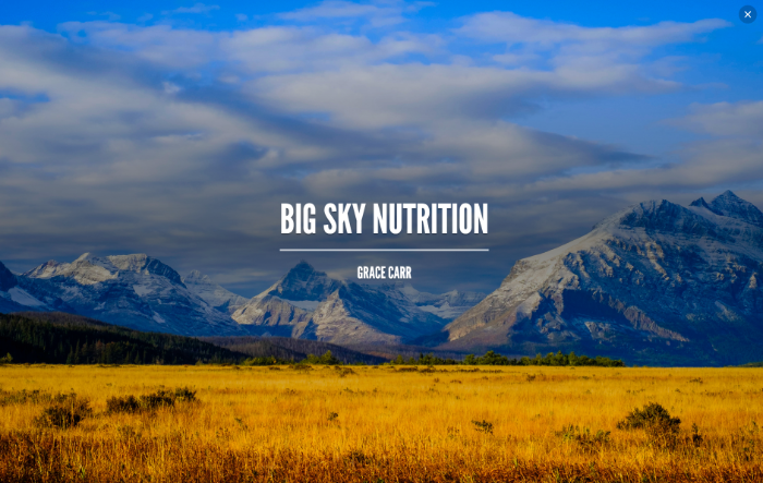 Big Sky Nutrition text over a grassy field with mountains in the background